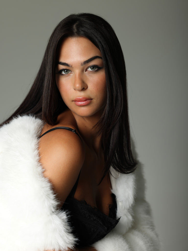 Woman wearing White Faux Fur Coat