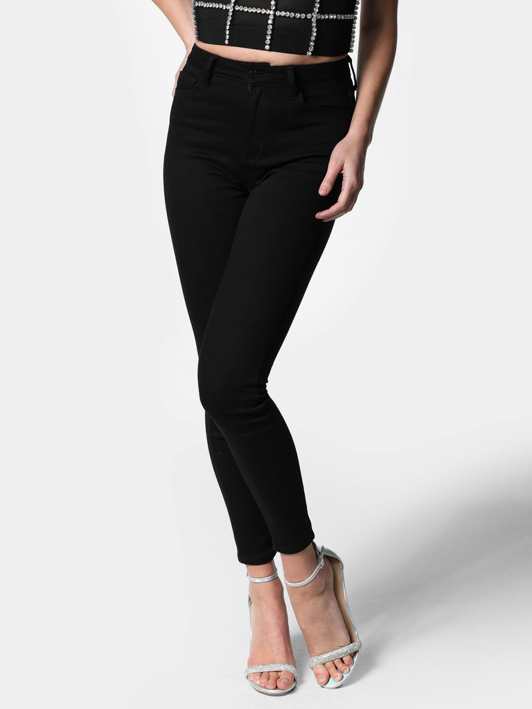 Woman wearing Black High Rise Skinny Jeans