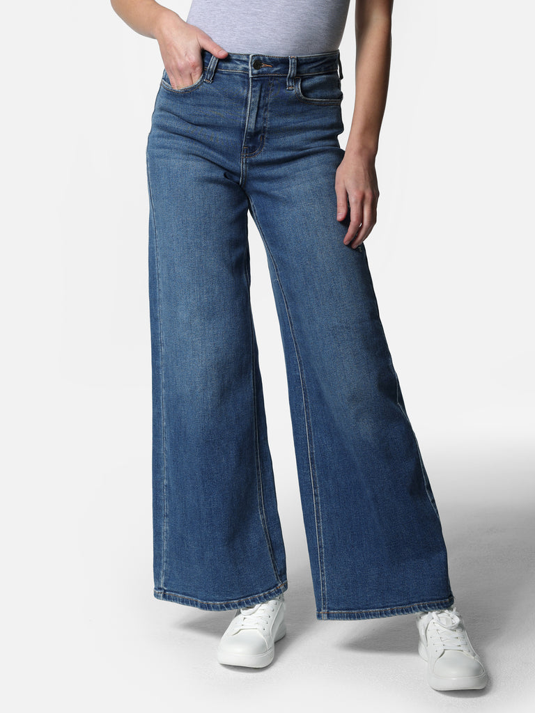 Woman wearing Wide Leg Medium Wash Jeans