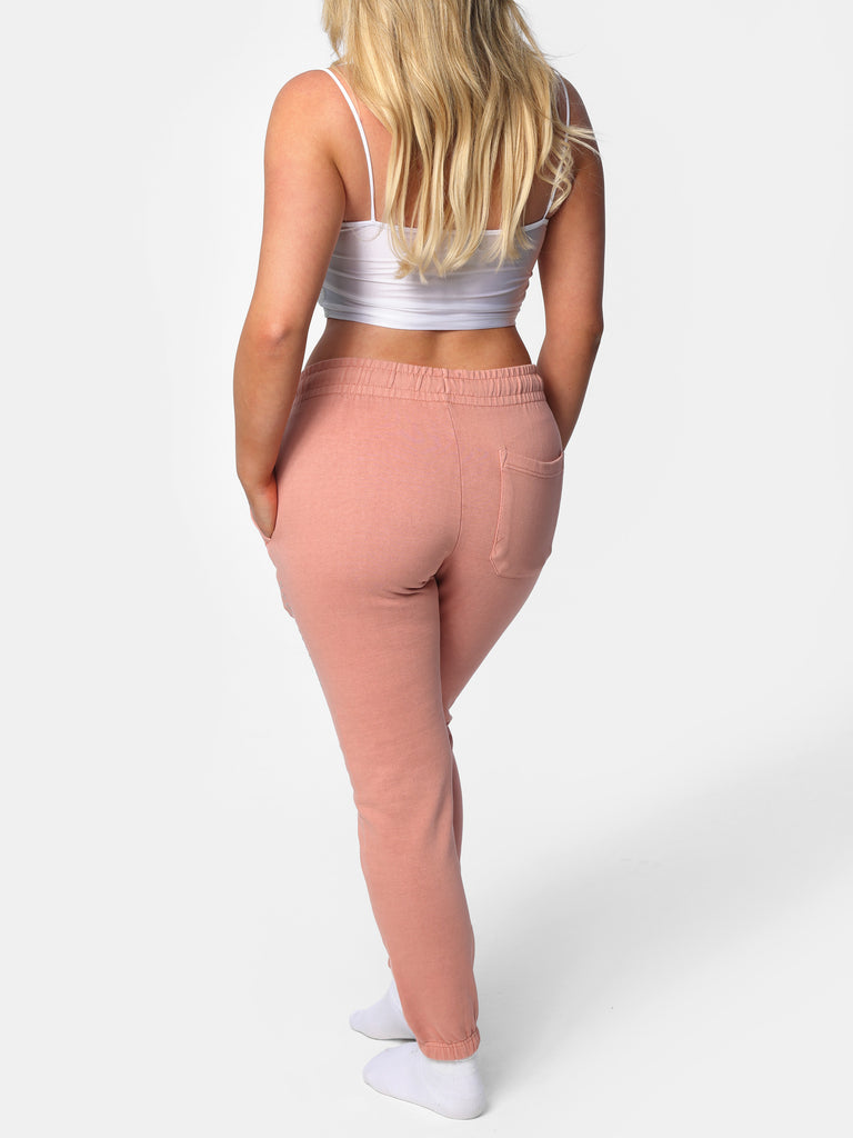 Woman wearing Pink Peach Bedazzled Joggers