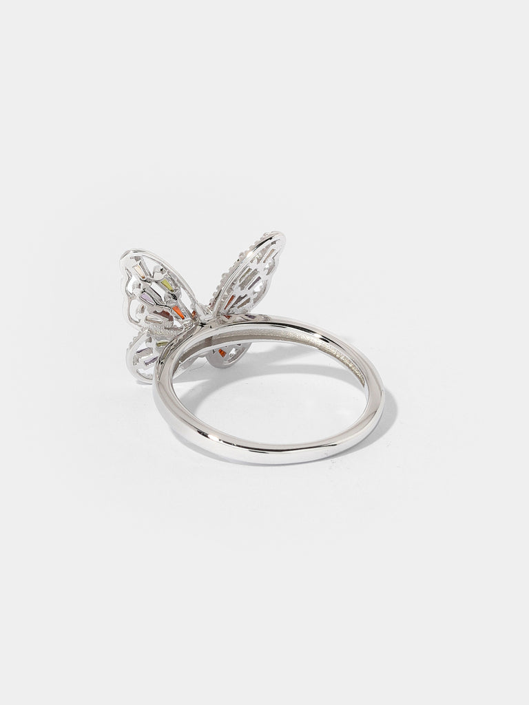 Product image of silver butterfly shaped ring with green, red, peach, and purple colored gems