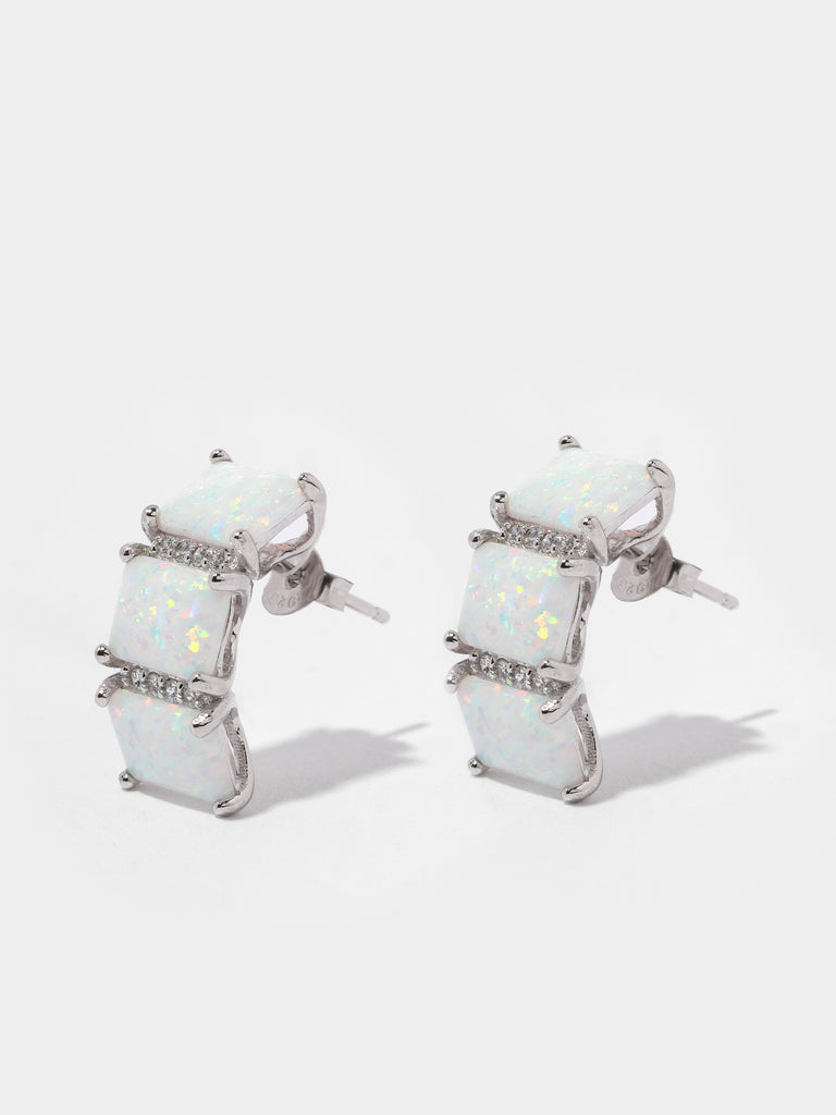 silver stud earrings with 3 square shaped opal gems and two columns of clear-colored crystals in between them