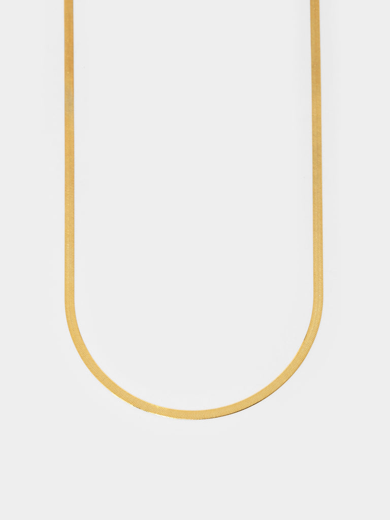 gold necklace with thick herringbone chain