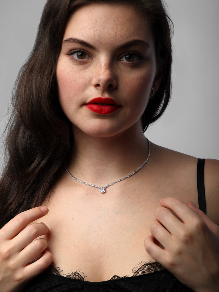woman wearing a raindrop crystal checker necklace