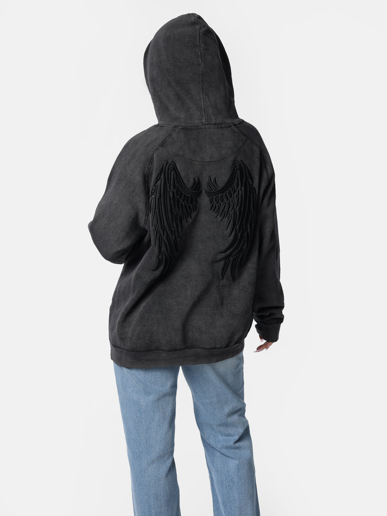 Woman wearing Vintage Black Embroidered Wings Hoodie