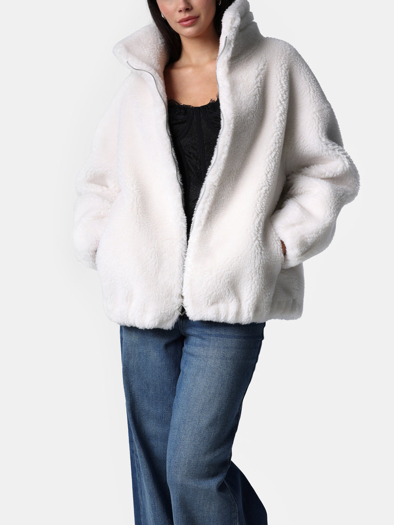 Woman wearing White Sherpa Zip Up Jacket