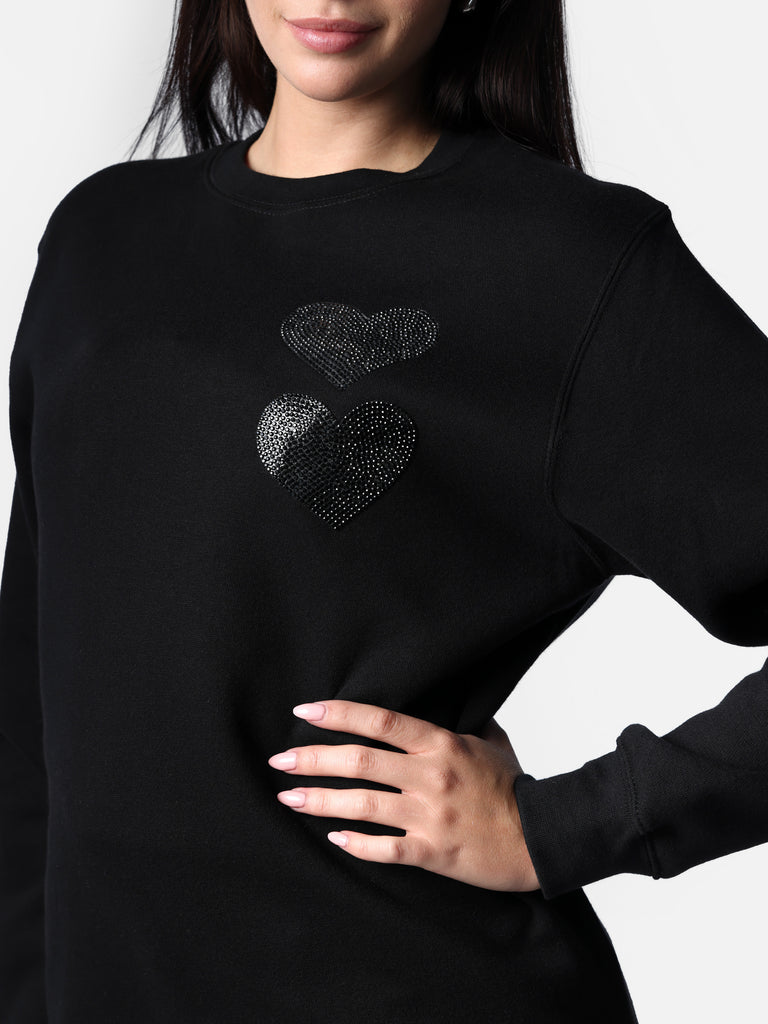 Woman wearing Bedazzled Black Twin Hearts Crewneck Sweater