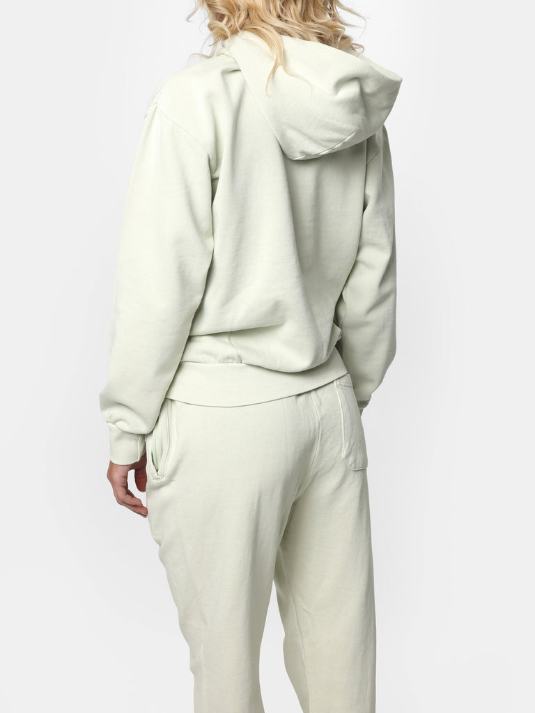 Woman wearing Bedazzled Initial Pistachio Hoodie