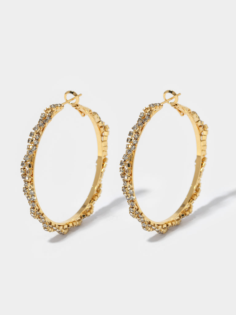 Image of gold hoops covered in small clear crystals in criss-cross pattern