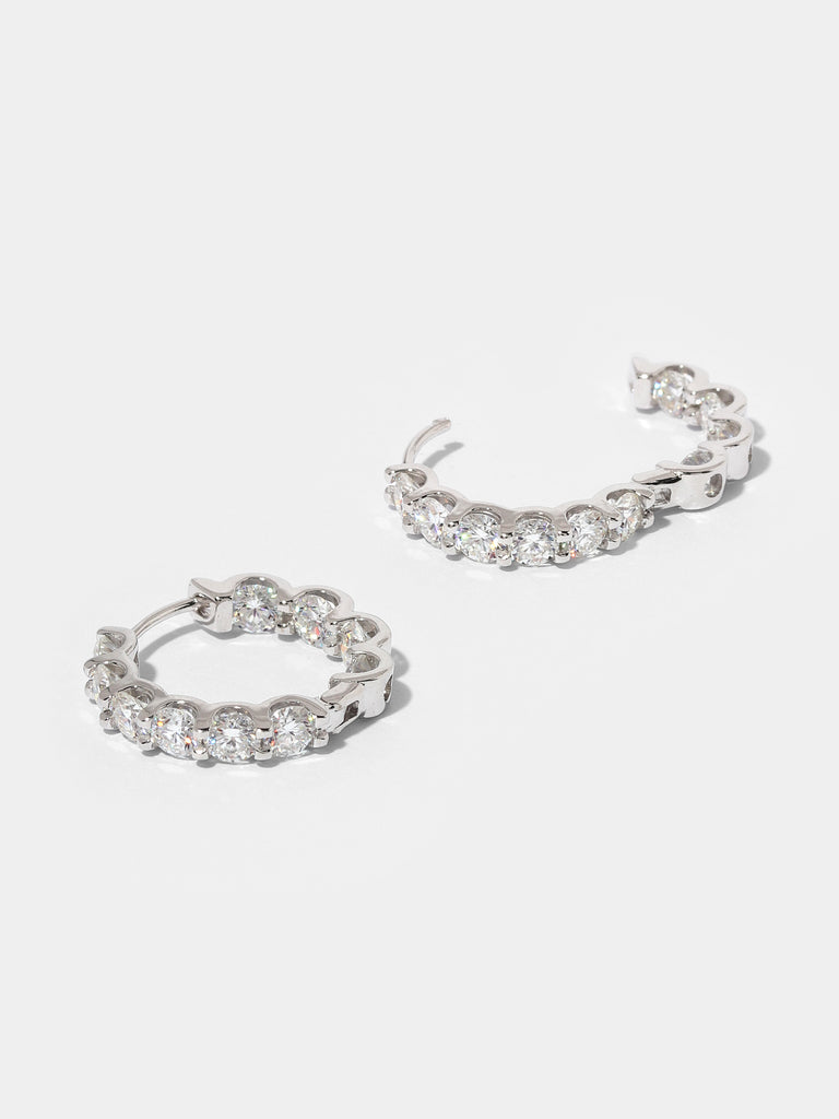 silver hoops covered in 10 clear-colored crystals