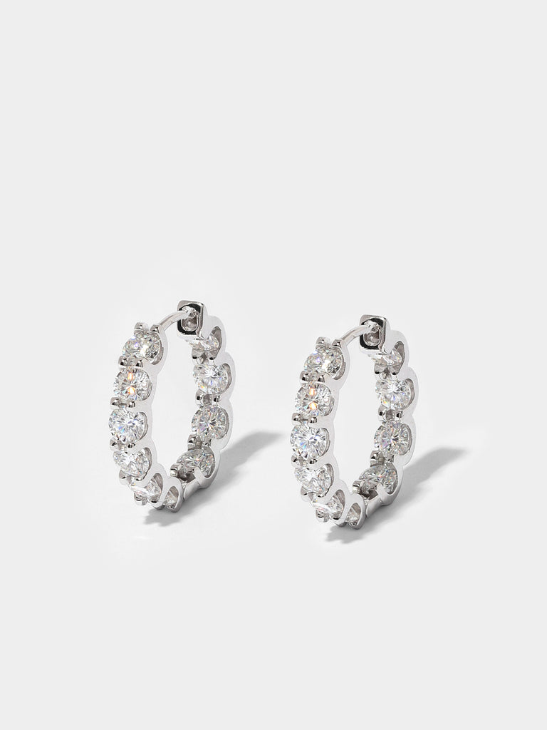 silver hoops covered in 10 clear-colored crystals 