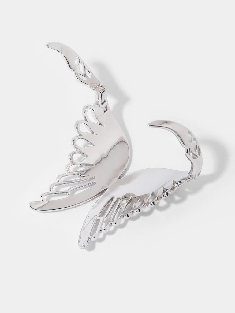 Product image of a silver angel wing shaped cuff bracelet covered in small crystal gems