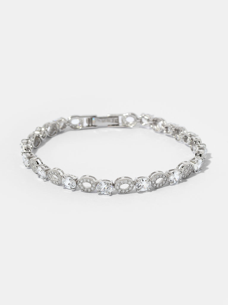 Silver bracelet with oval clear crystals and oval shaped motif adorned with smaller clear colored crystals