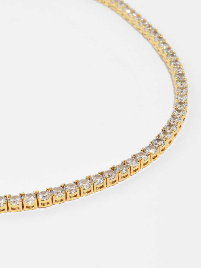 gold necklaces with round clear-colored, crystals all around