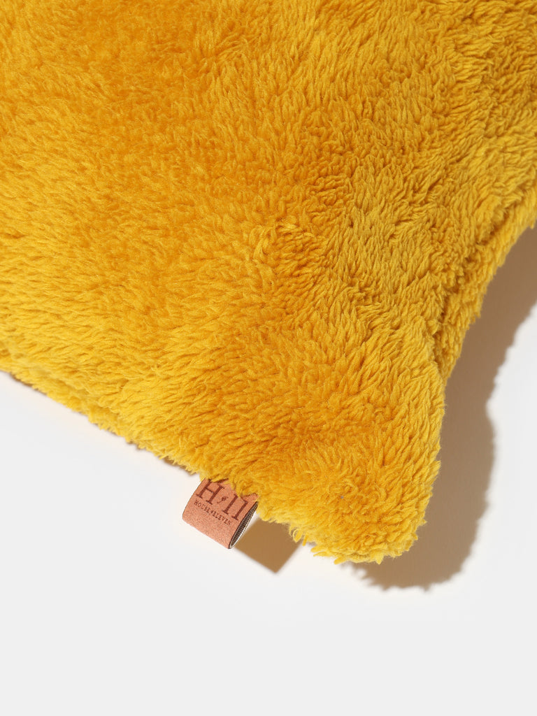 Golden Cozy Fuzz Pillow Case showing house of eleven tag