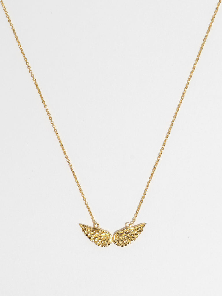 gold necklace with angel wing motif pendant