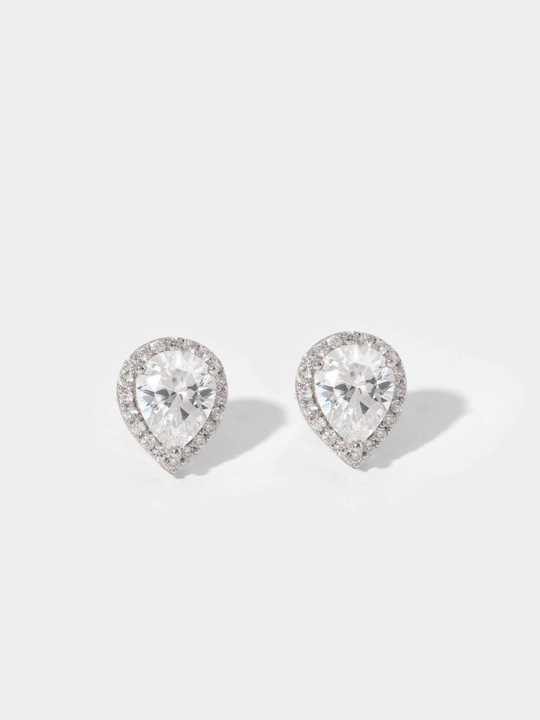 image of silver stud earrings with large, clear-colored, pear shaped gem outlined by small round crystals