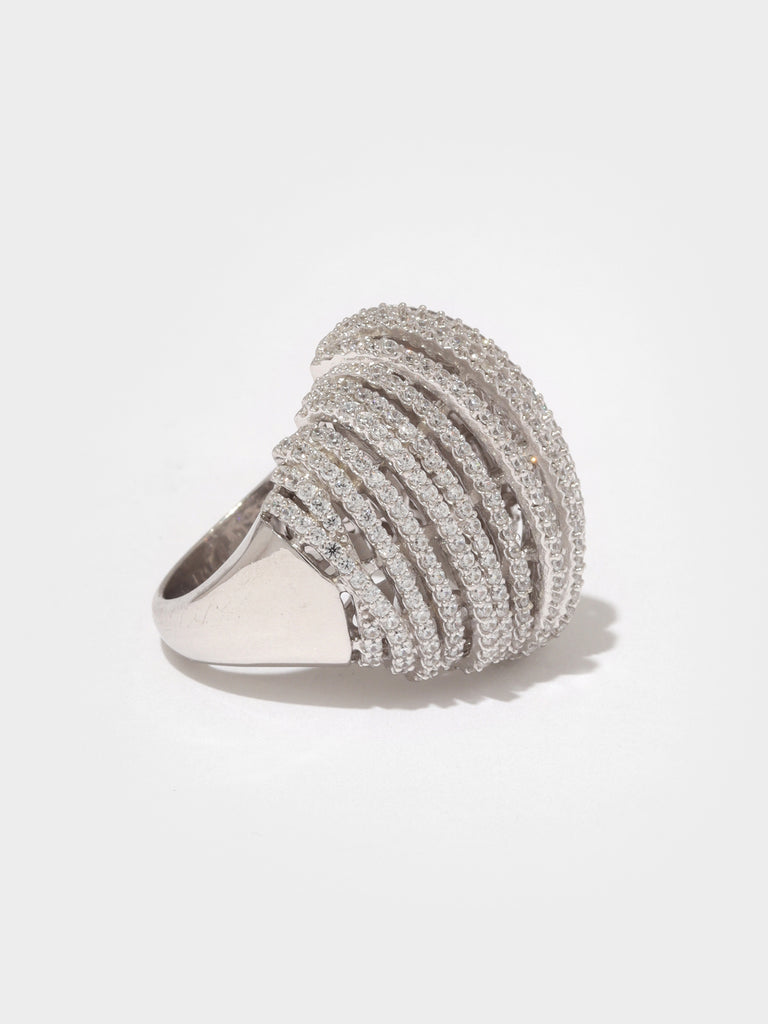 dome shaped silver ring made of columns lined with small, round, clear-colored crystal gems