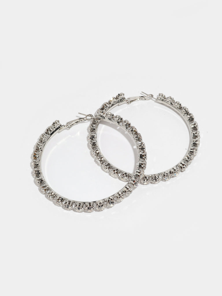 a pair of silver crystal hoops