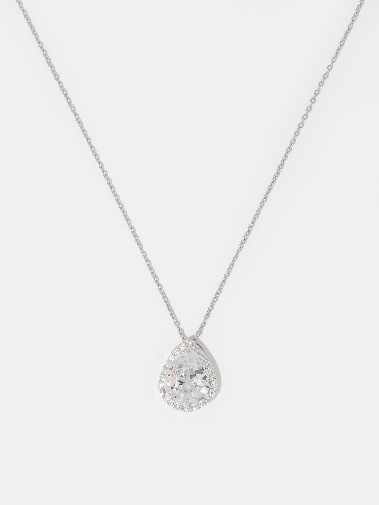 image of silver necklace with large clear-colored, pear shaped gem outlined by small round clear-colored crystals
