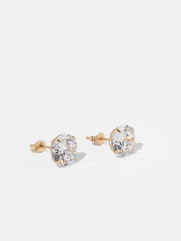 gold stud earrings with large, round, clear-colored gems