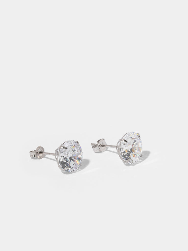 silver stud earrings with large, circle, clear-colored gem