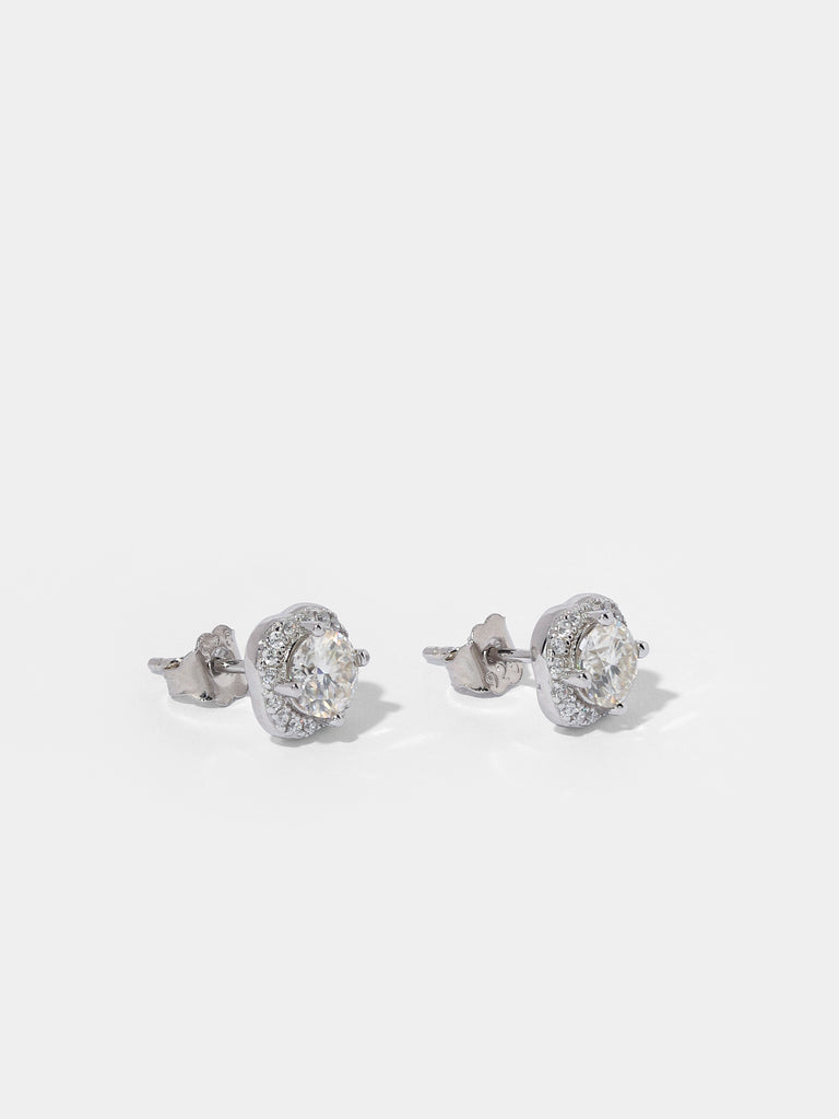 Image of silver stud earrings with large square shape clear-colored gem outlined by smaller clear-colored gems