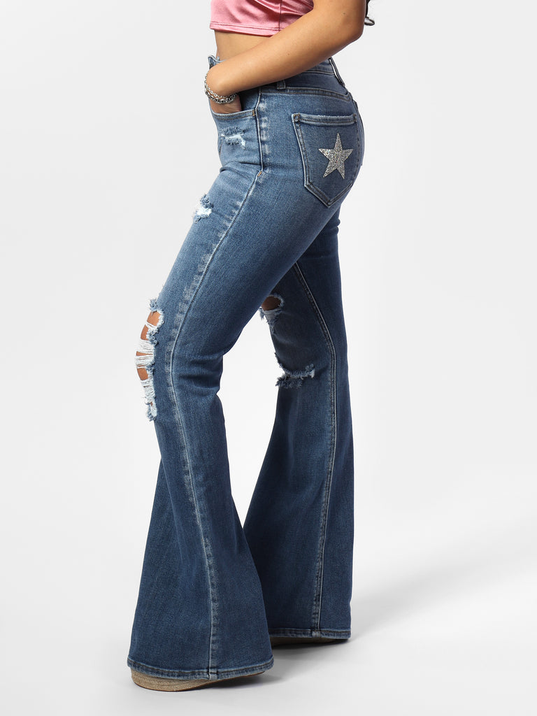 Woman wearing Stacey's Star Medium Wash Distressed Flare Jeans