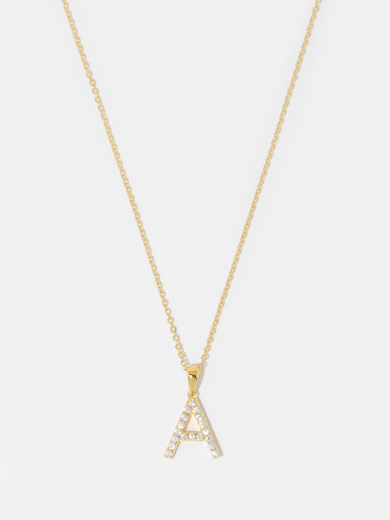 gold necklace with a pendant in the shape of letter A