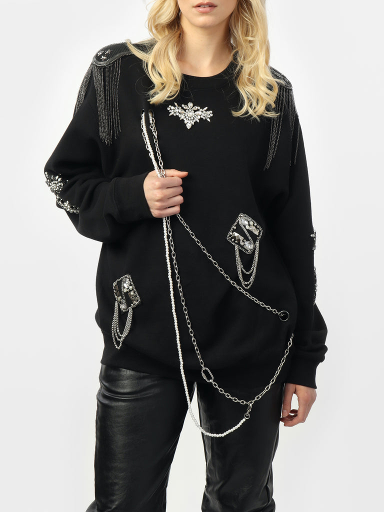 Woman wearing Stacey's Glam & Chain Sweater