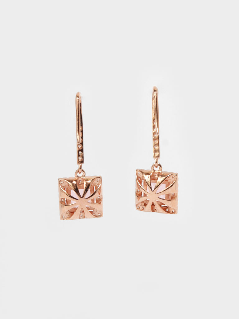 back of rose gold dangle hook earrings with large square, pink gem surrounded by small clear-colored crystal gems