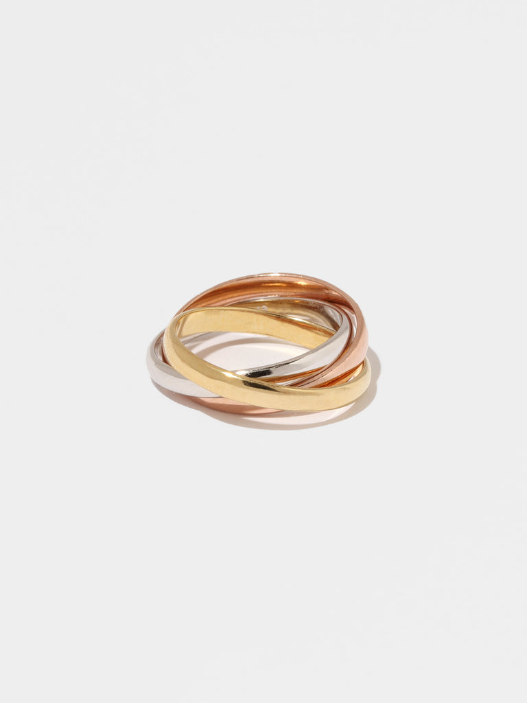 ring with three colored bands interlocked together; gold, silver, and rose gold