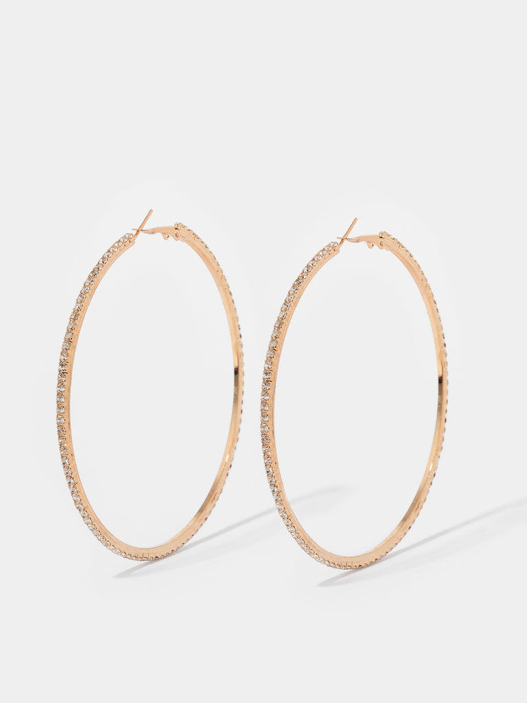 gold hoops lined with small clear crystal gems