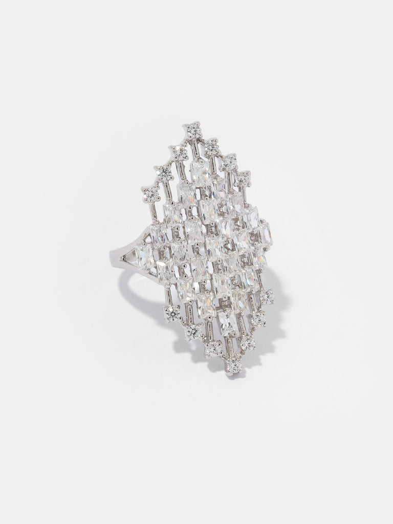 silver ring with hexagon center with hollow lattice design adorned by rectangle and round clear-colored gems